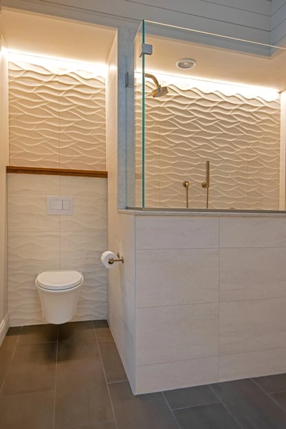 floating toilet, large square tile and swirl backsplash