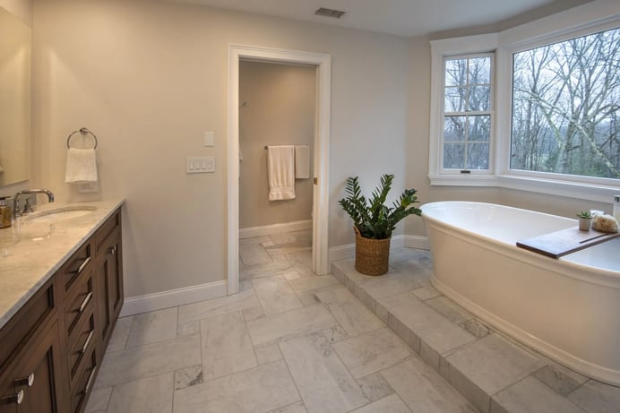 primary bathroom soaking tub and window platform in Lexington, MA