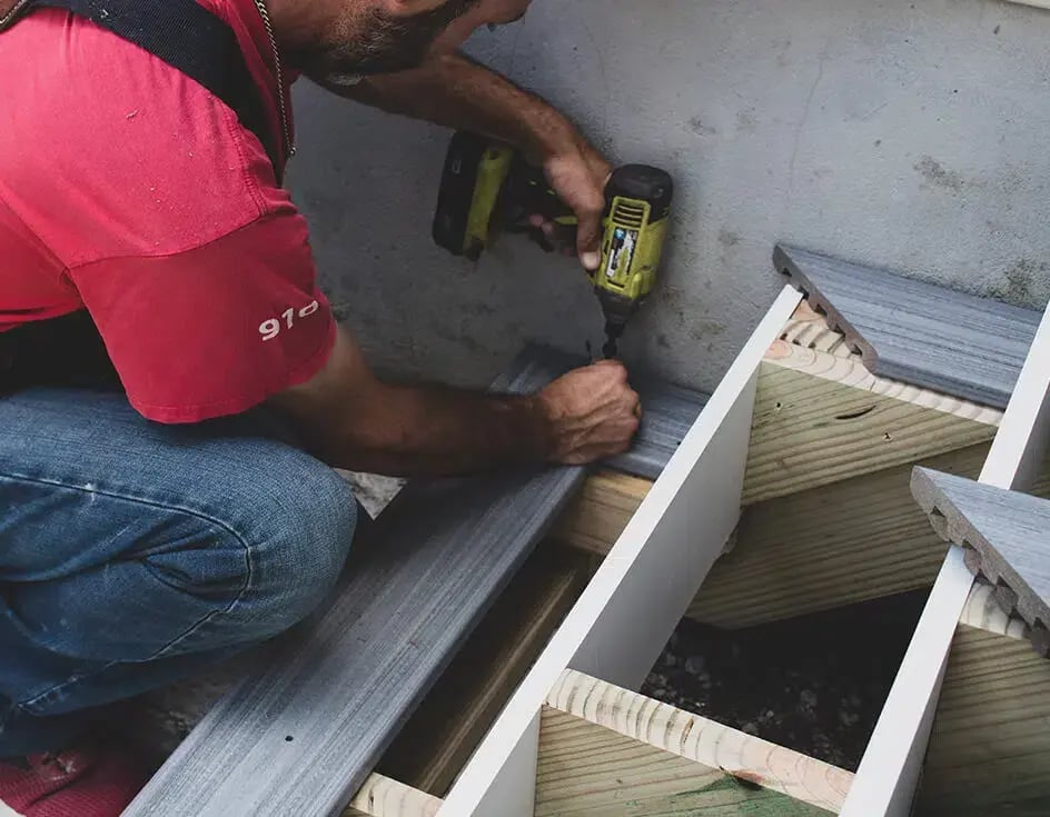 construction worker installing a deck