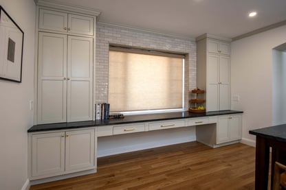 A classic transitional design serving as an extension of a kitchen remodel in Andover, MA by Blackdog Design/Build/Remodel featuring additional cabinets and space for serving.
