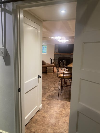 open doorway leading to fireplace and dining room