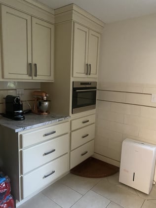 A "before" view of a kitchen corner before a remodel and transformation was completed by Blackdog Design/Build/Remodel in Andover, MA
