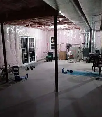 Dark unfinished basement with windows installed