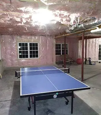 Dark unfinished basement with windows installed