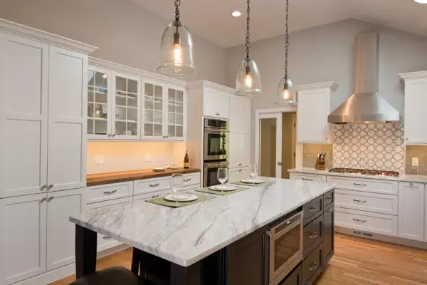 Contrasting kitchen remodel with white features and black island