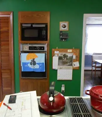 living room ceiling with dark beams running across