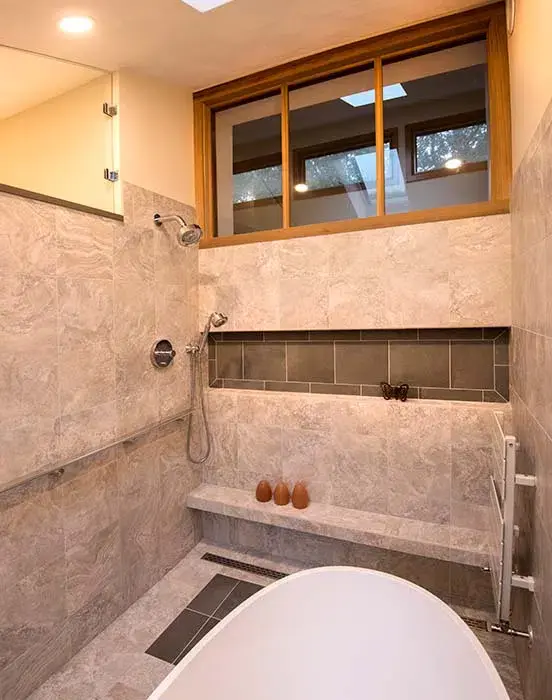 Outdoor screened in room with chairs and white accents