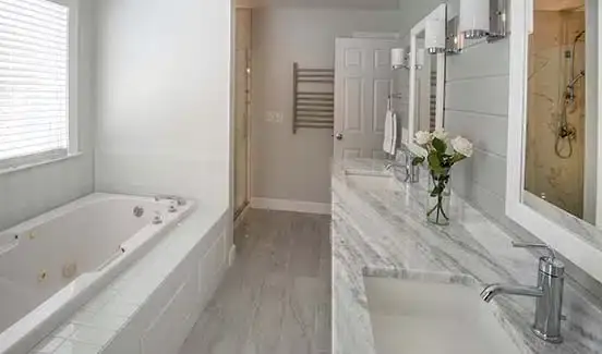 Bathroom with black granite countertop and toilet