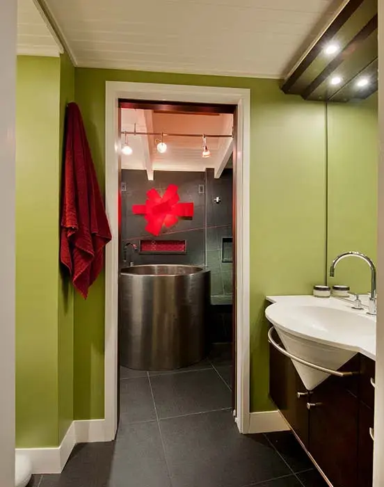 Bathroom with wooden cabinets and steel sink