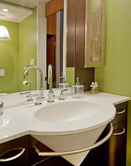Bathroom with wooden cabinets and steel sink