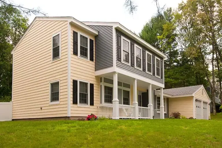Home exterior with second-story bump-out addition over a covered patio.