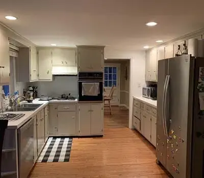 Small kitchen with gray cabinets and silver appliances
