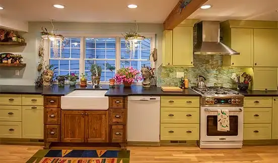 Colorful kitchen renovation with plants, wooden, pastel green and yellow accents