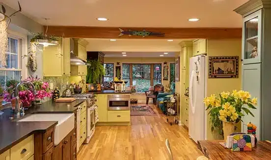 Colorful kitchen renovation with plants, wooden, pastel green and yellow accents
